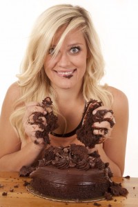 Woman With Handfuls Of Cake Smile
